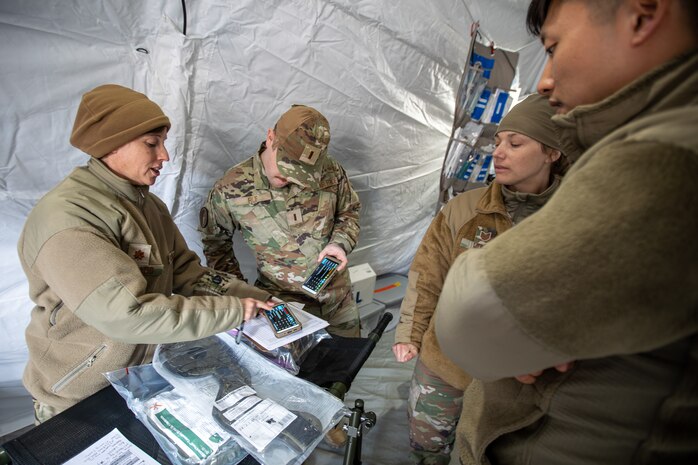 Alaska Air National Guard medical personnel with the 176th Medical Group talk through upcoming medical scenarios to prepare for practical exercises during Northern Edge 23-1 at Joint Base Elmendorf-Richardson, Alaska, May 12, 2023.
