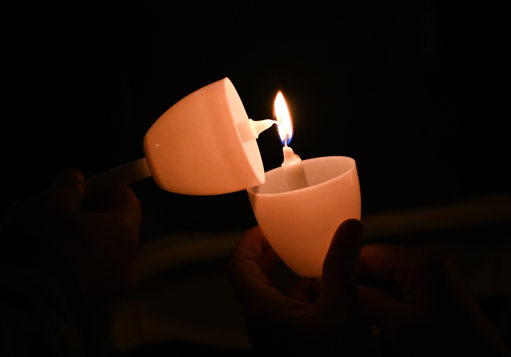 Attendees light candles in remembrance of law enforcement officers killed in the line of duty during a candlelight vigil on the National Mall in Washington, D.C. May 13, 2023. The National Law Enforcement Officers Memorial in Washington D.C. is the nation’s monument to peace officers who have died in the line of duty—and two U.S. Air Force Airmen from Joint Base Elmendorf-Richardson, Alaska were honored during the 35th Annual Candlelight Vigil, May 13. (U.S. Air Force photo by Abigail Meyer)