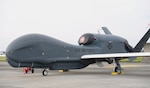An RQ-4 Global Hawk, assigned to the 4th Reconnaissance Squadron, 319th Operation Group, Andersen Air Force Base, Guam, sits on the flightline at Yokota Air Base, Japan, May 2, 2023. U.S. Pacific Air Forces began positioning RQ-4 Global Hawks at Yokota Air Base, Japan, from Andersen Air Force Base, Guam, on May 15 to provide theater-wide enduring operations in support of maintaining a free and open Indo-Pacific. (U.S, Air Force photo by Yasuo Osakabe)