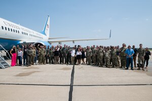 Family, friends, 932nd Airlift Wing personnel and local civic leaders gather around Col. Glenn Collins, 932nd AW commander, for a group photo in front of a C-40C Clipper aircraft upon the conclusion of his fini flight.