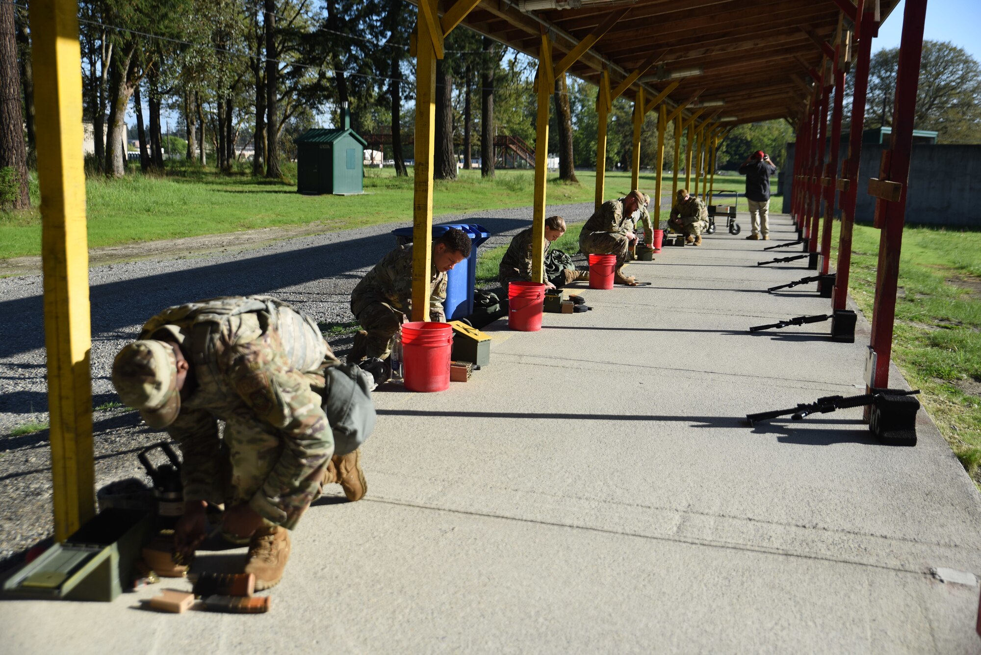 Team McChord Airmen prepare their ammunition during weapons qualification training at Joint Base Lewis-McChord, Washington, May 10, 2023. Weapons qualifications are held to ensure service members are deployment ready. (U.S. Air Force photo by Airman 1st Class Kylee Tyus)