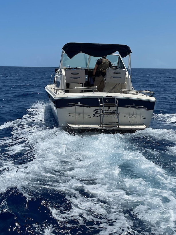 A Customs and Border Protection Air Marine crew stops a 33-foot pleasure craft about 12 miles east of Haulover Inlet, Florida, May 17. 2023. The vessel contained 29 people aboard attempting to unlawfully migrate to the U.S. (U.S. Coast Guard photo)