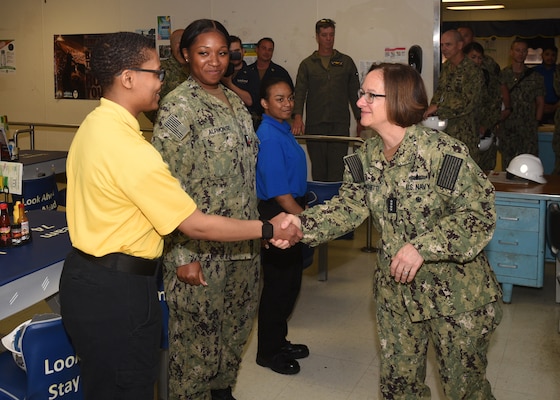 Adm. Lisa Franchetti, Vice Chief of Naval Operations, talks with Culinary Specialist 2nd Class Lashaun Swain, from Chicago, during a tour of the Nimitz-Class aircraft carrier USS John C. Stennis, May 23, 2023.