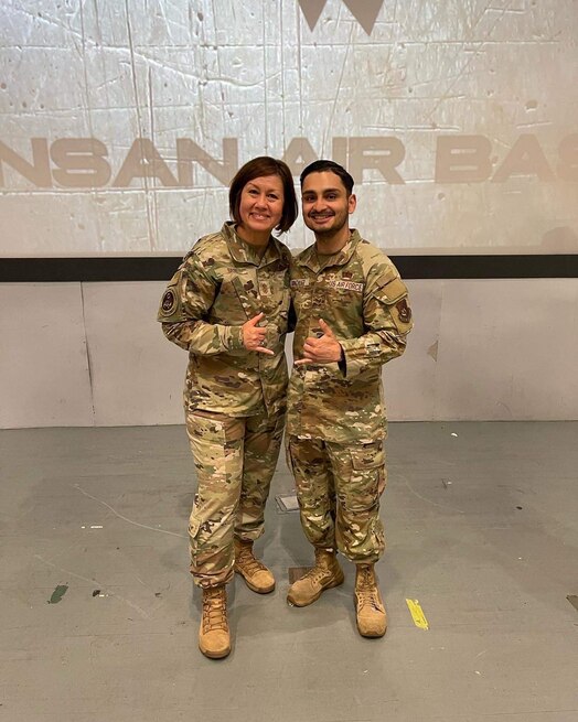  U.S. Air Force Chief Master Sgt. JoAnne Bass, Chief Master Sgt. of the U.S. Air Force and U.S. Air Force Tech Sgt. William Gonzalez pose for a photo together. Gonzalez credits the U.S. Air Force core values and his nine years of active-duty experience for being able to quickly react and save the life of crash victim Elizabeth Gray Edwards. (Courtesy photo)