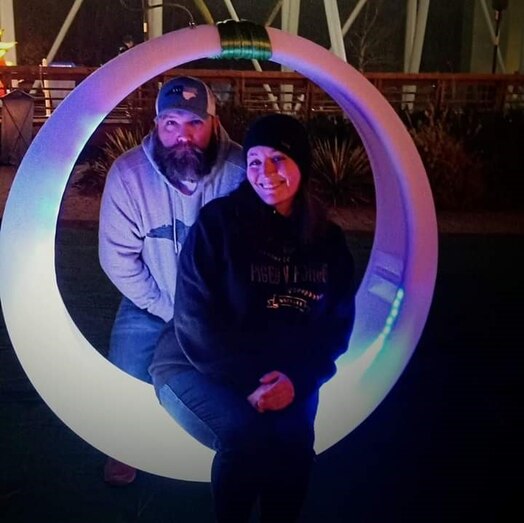  Crash victim Elizabeth Gray Edwards of Greenville, North Carolina, smiles alongside husband Gary Williams. Edwards is beyond thankful for U.S. Air Force Tech Sgt. William Gonzalez's heroic action of saving her from her submerged vehicle. (Courtesy photo)