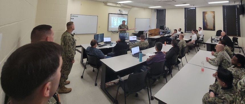 230511-N-N0443-3045 SAN DIEGO (May 11, 2023) Surface Combat Systems Training Command’s (SCSTC) Commodore, Capt. George A. Kessler, Jr., meets with Sailors and civilians from Southwest Regional Maintenance Center and SCSTC Det Southwest who are participating in SCSTC’s Virtual Maintenance Trainer (VMT) pilot program.  The objective of SCSTC’s six-month pilot is to test the effectiveness of standalone VMT systems to support maintenance skill, proficiency training, and maintenance support across the waterfront community. (Photo courtesy Surface Combat Systems Training Command)