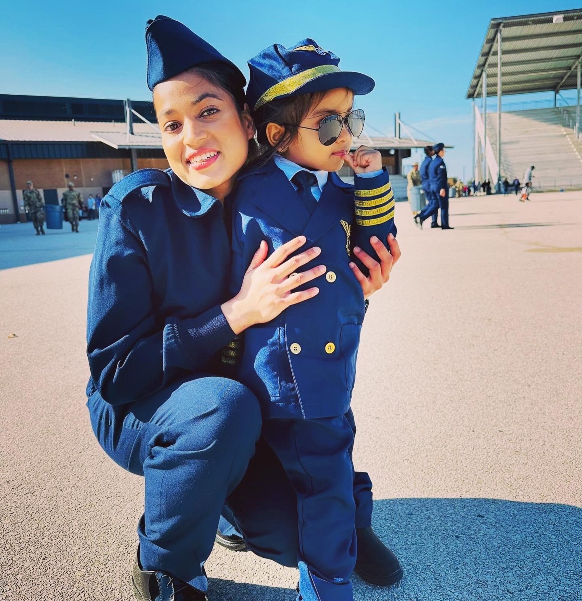 A person posing for a photo with a child