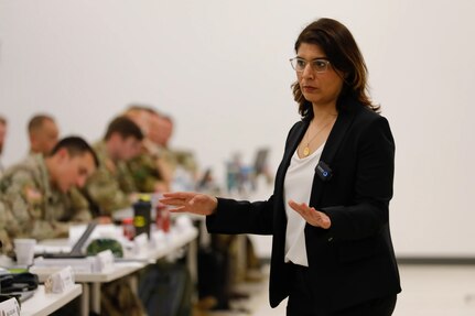 Sahr Muhammedally, director for the Middle East, North Africa and South Asia at the Center for Civilians in Conflict, lectures on Civilian Harm Mitigation in Urban Warfare at Joint Forces Training Base, Los Alamitos, California, May 15, 2023. The Urban Operations Planner Course brings together urban experts to provide military personnel with scenarios that simulate the complexities and challenges of large-scale urban combat.