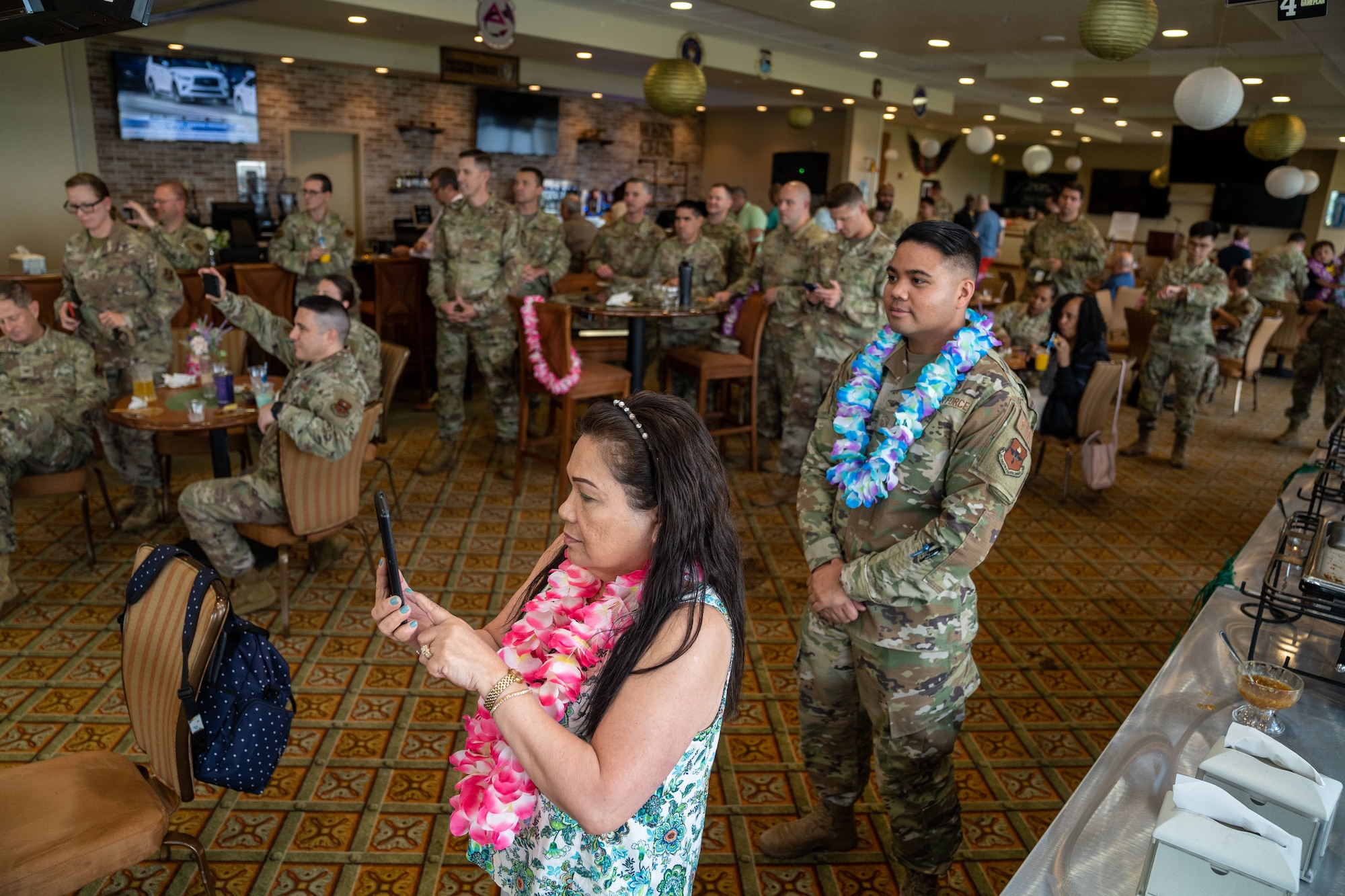 Airmen from the 81st Training Wing gather for food, drinks, and a performance by the White Tiger Lion Dance team during the Asian American and Pacific Islander Heritage Month social event at Keesler Air Force Base, Mississippi, May 24, 2023.