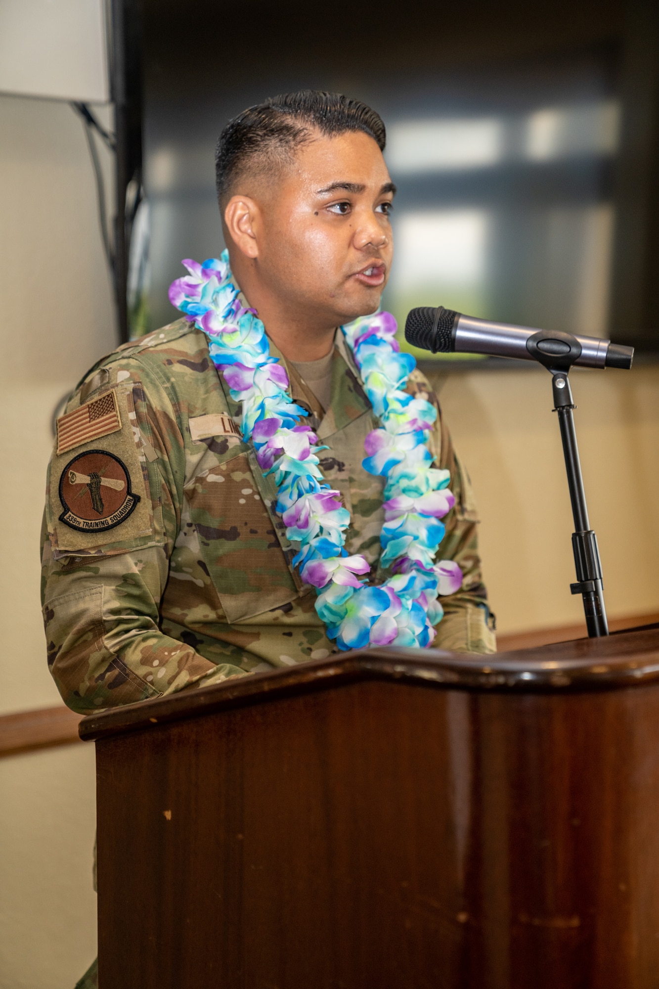 U.S. Air Force Master Sgt. Justin Limos, 335th Training Squadron financial management learning center flight chief, gives opening remarks during the Asian American and Pacific Islander Heritage Month social event at Keesler Air Force Base, Mississippi, May 24, 2023.