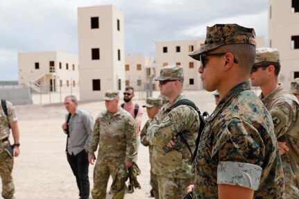 Brigade and division-level officers and senior noncommissioned officers in the 40th Infantry Division's Urban Operations Planner Course conduct a practical exercise at the Fort Irwin National Training Center, California, May 16, 2023. Course students visited the NTC's mock town of Razish to examine urban warfare scenarios in collaboration with NTC cadre.