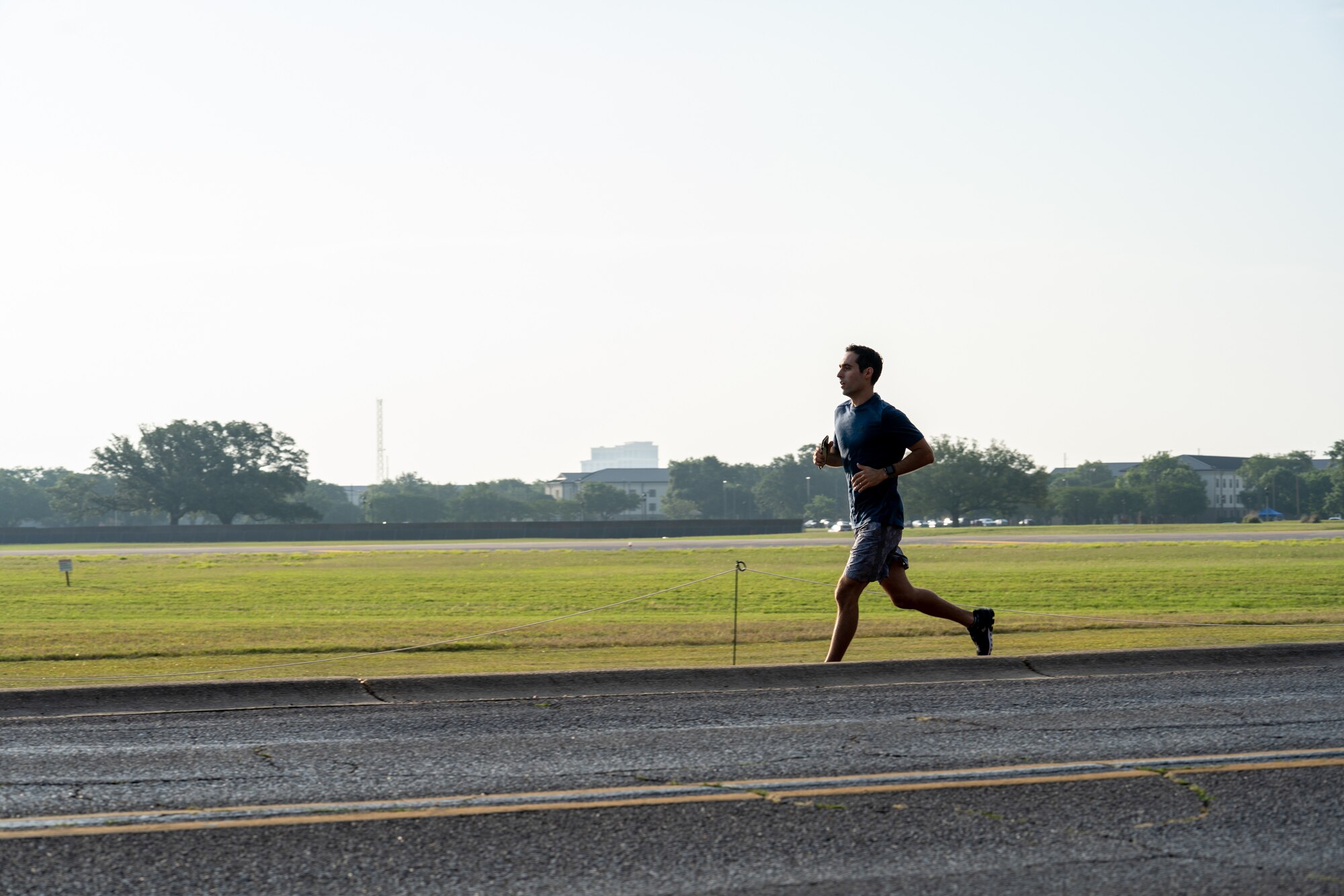 U.S. Air Force Tech. Sgt. Anthony Dibenedetto, 41st Aerial Port Squadron air transportation, participates in the World War II Bataan Death March Memorial 5K run and ruck during Asian American and Pacific Islander Heritage Month at Keesler Air Force Base, Mississippi, May 25, 2023.