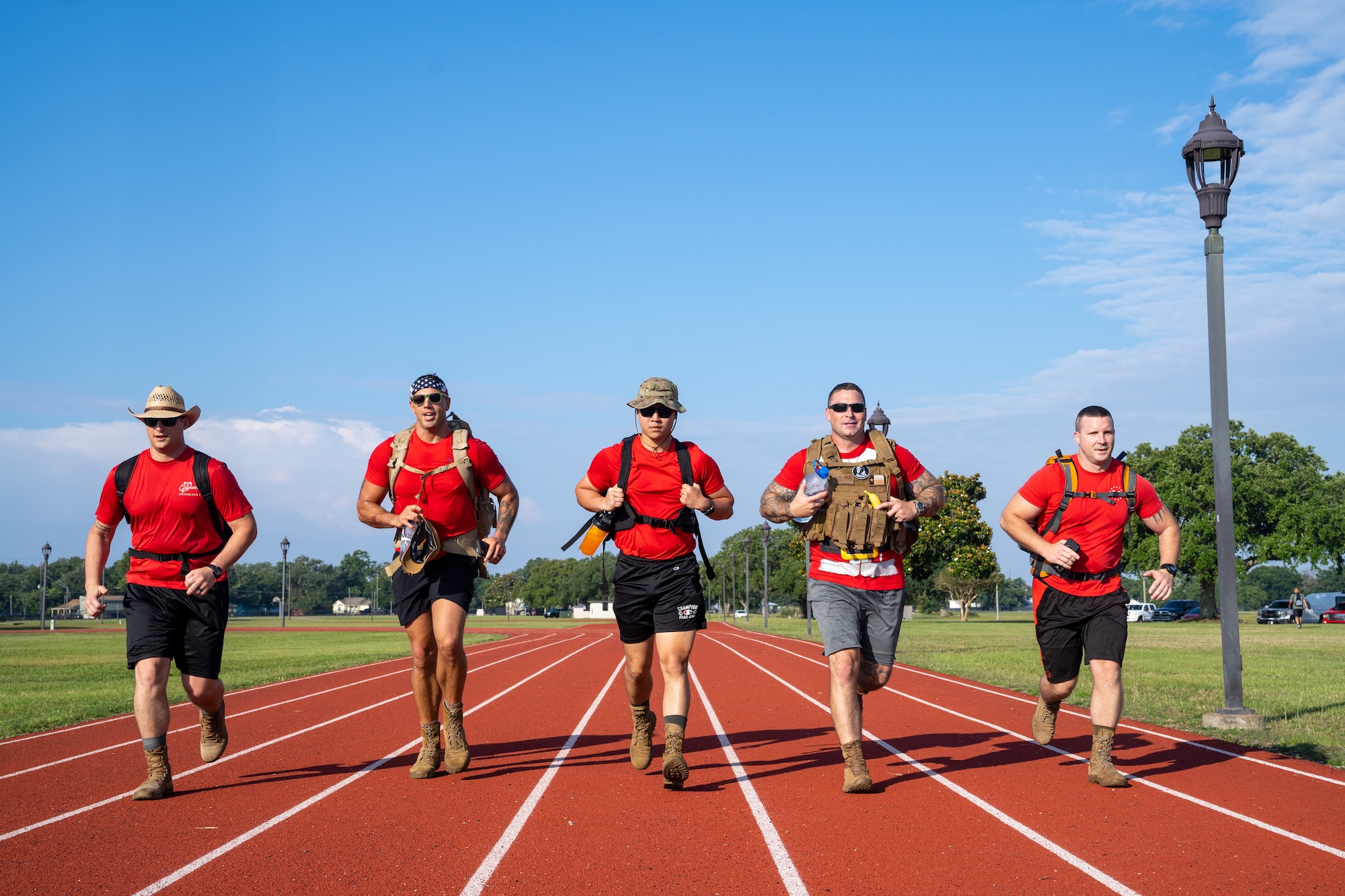 Airmen from the 81st Training Wing participate in the World War II Bataan Death March Memorial 5K run and ruck during Asian American and Pacific Islander Heritage Month at Keesler Air Force Base, Mississippi, May 25, 2023.