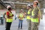Lt. Gen. Scott Spellmon, 55th Chief of Engineers, discusses the U.S. Army Corps of Engineers Transatlantic Middle East District’s (TAM) program in Qatar with Resident Engineer Leonora Leigh while touring a logistics complex currently under construction by USACE in Qatar.  The Transatlantic Middle East District works with U.S. military and allied nation partners in the region to provide design, construction and support services.