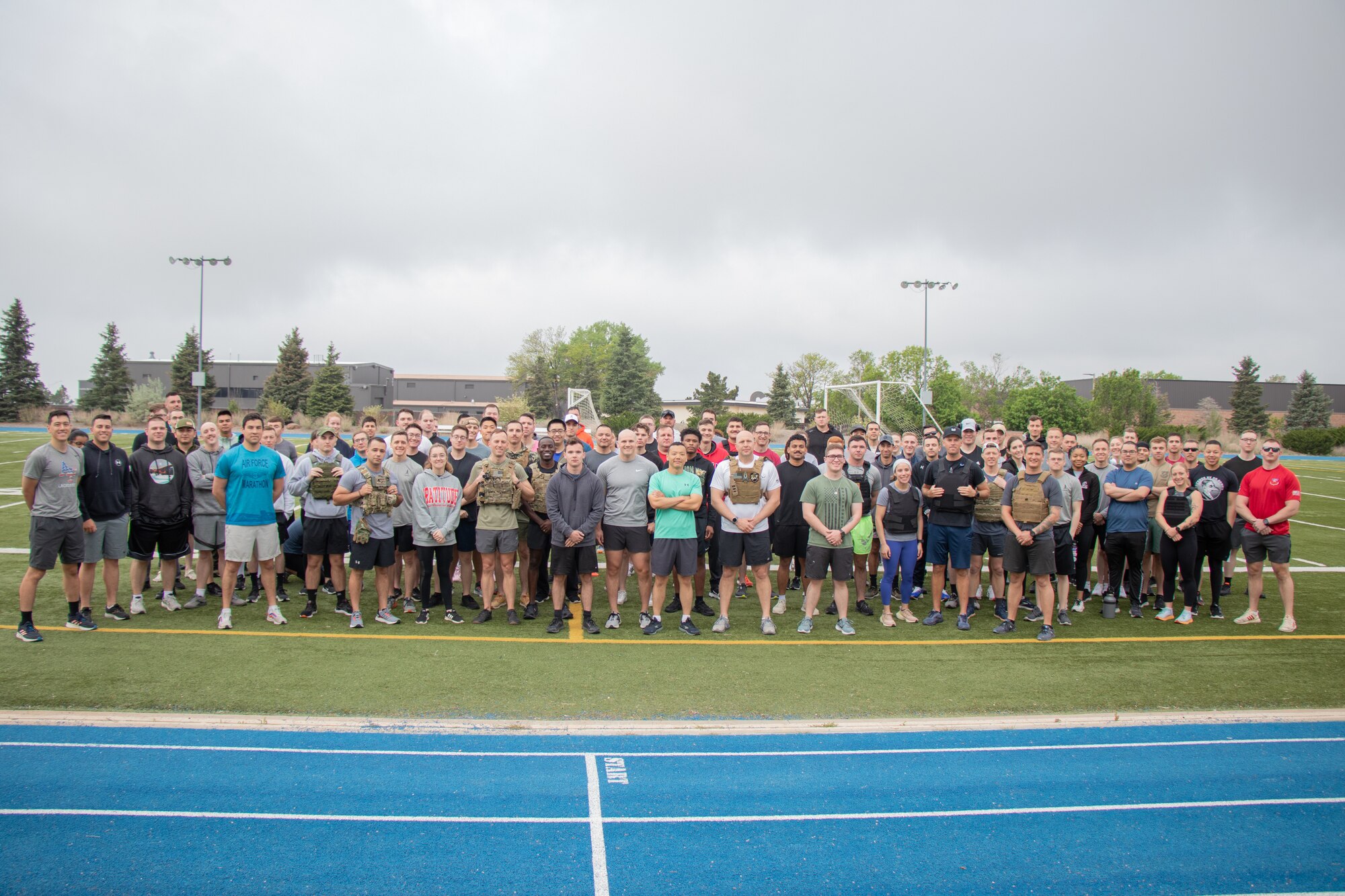 Members from Delta 3-Electromagnetic Warfare pose for a group photo before completing a Memorial Day workout on Peterson Space Force Base.