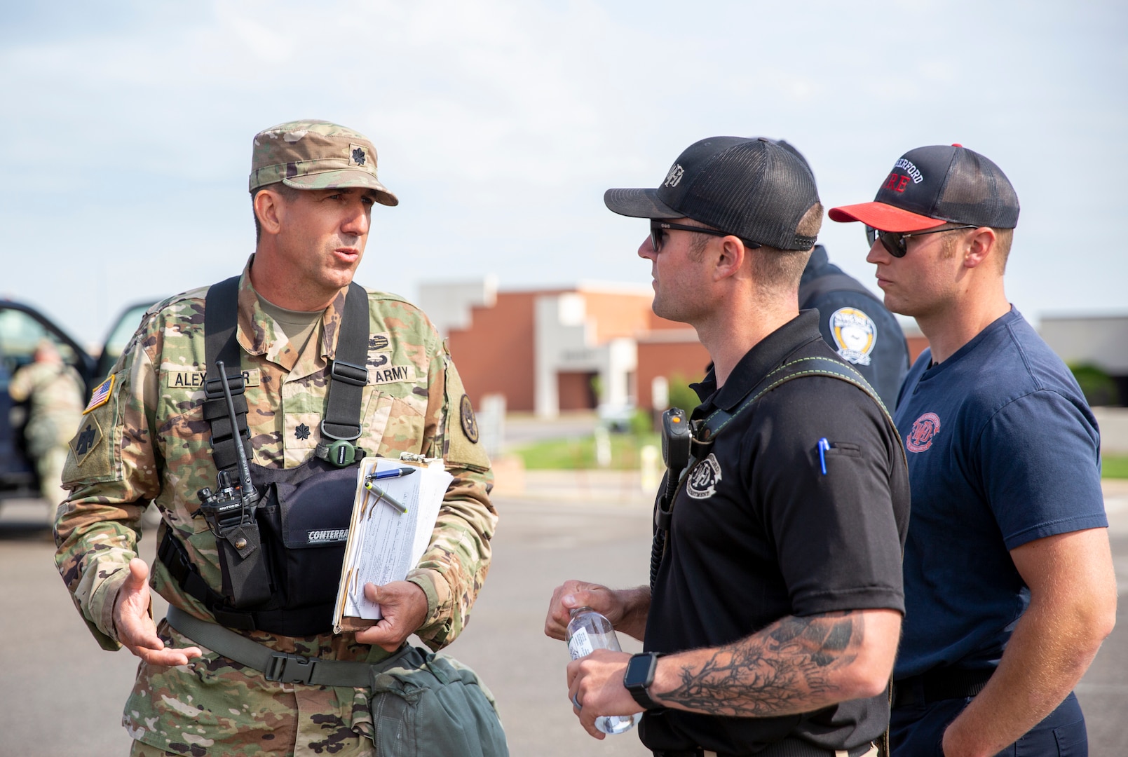 Oklahoma Guardsman, Lt. Col. Barrett Alexander (left), commander of the 63rd Civil Support Team (CST) collaborates with local first responders, including Capt. Thomas Elkouri (right), incident commander with the Weatherford Fire Department during a full-scale exercise held in Custer and Washita County and the City of Weatherford, May 23-25, 2023. The comprehensive exercise provided an invaluable opportunity for all participants to enhance their coordination, communication, and response capabilities. By training together, the Oklahoma National Guard's 63rd Civil Support Team, local first responders, and other agencies involved can help ensure effective and efficient collaboration in the face of emergencies. 

The training was designed and controlled by US Army North in order to assess the capabilities of both the first responders as well as the CST, including helping reinforce tactics and relationships between participating agencies for any broad spectrum of potential threats. (Oklahoma National Guard photo by Leanna Maschino)