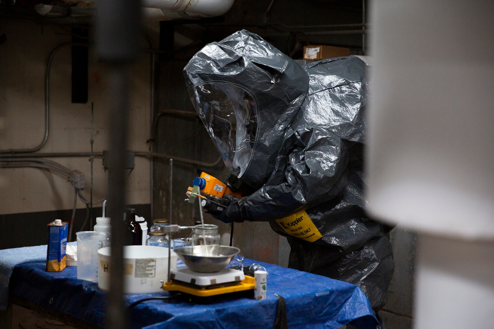 Oklahoma Army National Guardsman Sgt. Douglas Engel, member of the 63rd Civil Support Team, examines possible hazardous material during a training exercise May 23, 2023 in Weatherford, Oklahoma. In a joint effort to enhance emergency response capabilities, the Oklahoma National Guard's 63rd CST collaborated with local first responders during a full-scale exercise held in Custer and Washita County and the City of Weatherford, May 23-25, 2023. The comprehensive exercise provided an invaluable opportunity for all participants to enhance their coordination, communication, and response capabilities. (Oklahoma National Guard photo by Leanna Maschino)