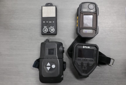 four Compact Vapor Chemical Agent Detector (CVCAD) prototypes displayed in a square