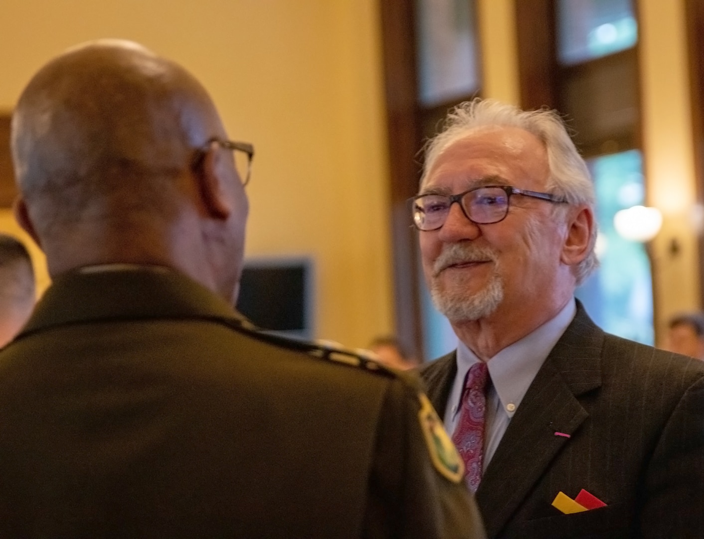 Patrick Van Nevel, Honorary Consul of the Kingdom of Belgium, talks with Maj. Gen. Rodney Boyd, Assistant Adjutant General-Army and Commander of the Illinois Army National Guard, during a ceremony commemorating the 78th anniversary of the rescue of King Leopold III from German Nazis during World War II by Soldiers from the Illinois Army National Guard’s 106th Cavalry Regiment and marking the 300th birthday of the Illinois National Guard in Springfield May 6.