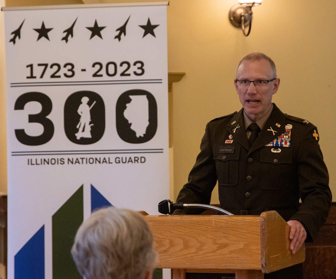 Col. Michael Eastridge, former commander of the 33rd Infantry Brigade Combat Team, addresses the crowd during a ceremony commemorating the 78th anniversary of the rescue of King Leopold III from German Nazis during World War II by Soldiers from the Illinois Army National Guard’s 106th Cavalry Regiment and marking the 300th birthday of the Illinois National Guard in Springfield May 6.