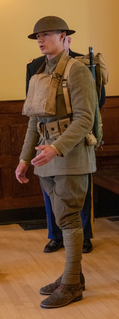 Staff Sgt. Ben Whitlock, an infantryman serving with Company C, 2nd Battalion, 130th Infantry Regiment, based in Litchfield, talks about the uniform and equipment Soldiers wore during World War I during the ceremony May 6.