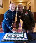 Maj. Gen. Rodney Boyd, Assistant Adjutant General – Army and Commander of the Illinois Army National Guard is joined by Airman 1st Class Ben Wyland, one of the youngest members of the Air National Guard Band of the Midwest, for a ceremonial cake cutting celebrating the Illinois National Guard’s 300th birthday during events in Springfield, Illinois, May 6.