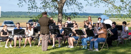 The Sparta High School band, under the direction of Band Director Keith Shasteen, performs a musical selection at the Illinois National Guard’s 300th birthday celebration in Kaskaskia May 9. Shasteen is a Chief Warrant Officer 2 in the Illinois Army National Guard, and is the commander of the 144th Army Band, based in Chicago.