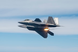 U.S. Air Force F-22 Raptors assigned to the 43rd Fighter Squadron drop flares