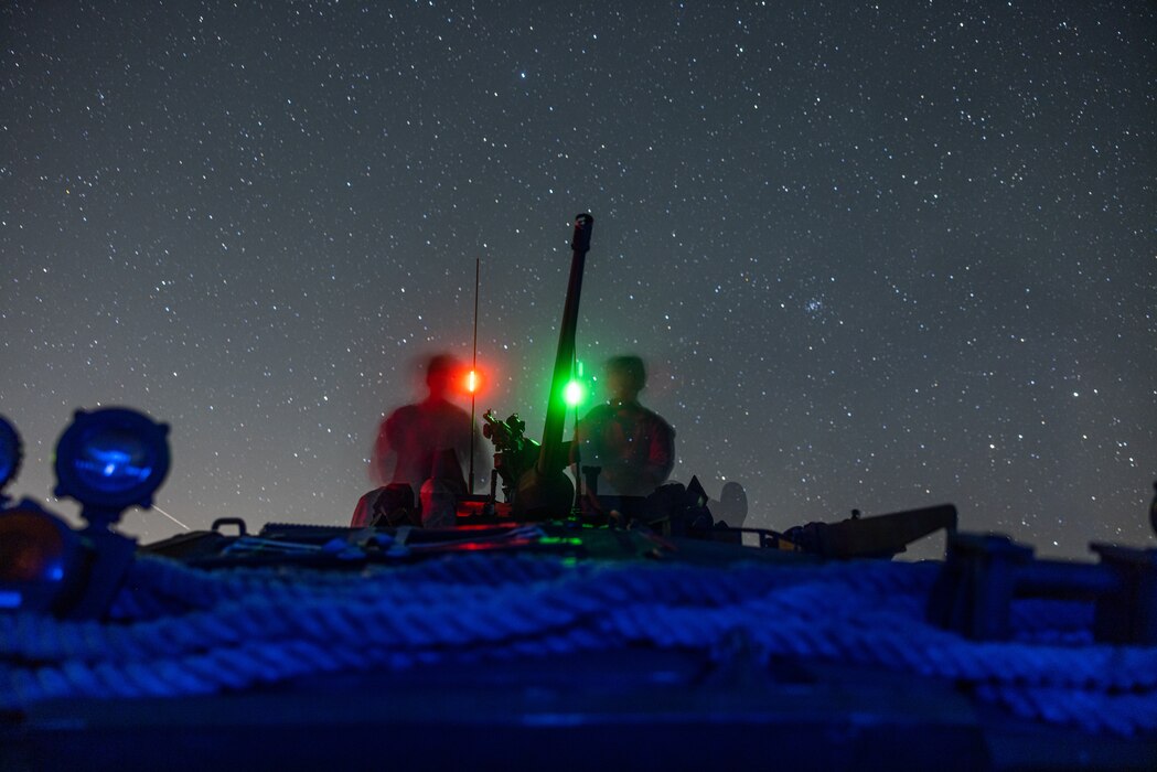 U.S. Marine Corps Light armored vehicles (LAV) assigned to 3rd and 1st Light Armored Reconnaissance Battalion, 1st Marine Division, are staged at night during the Bushmaster Challenge