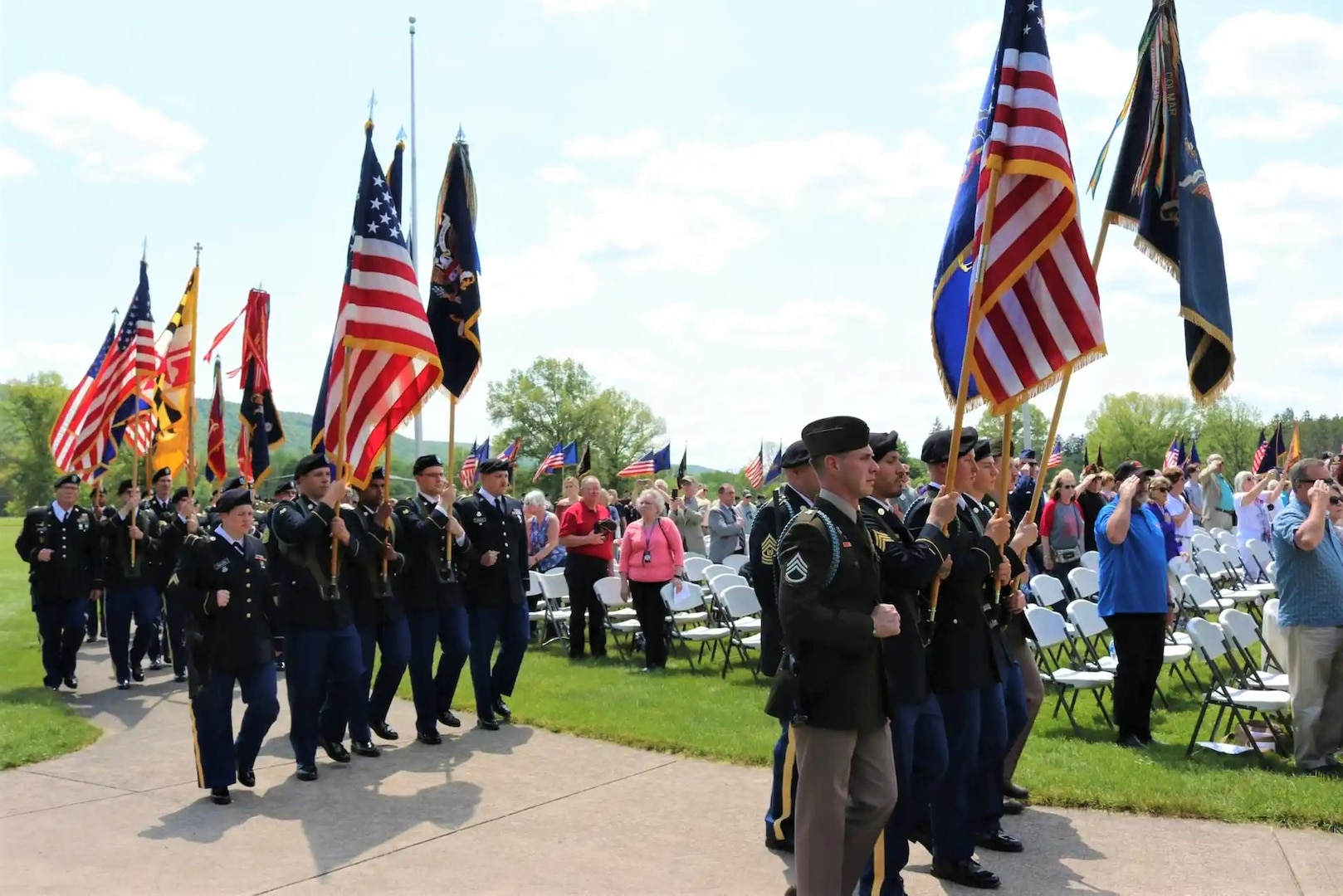 Memorial day. A female soldier in uniform salutes against the