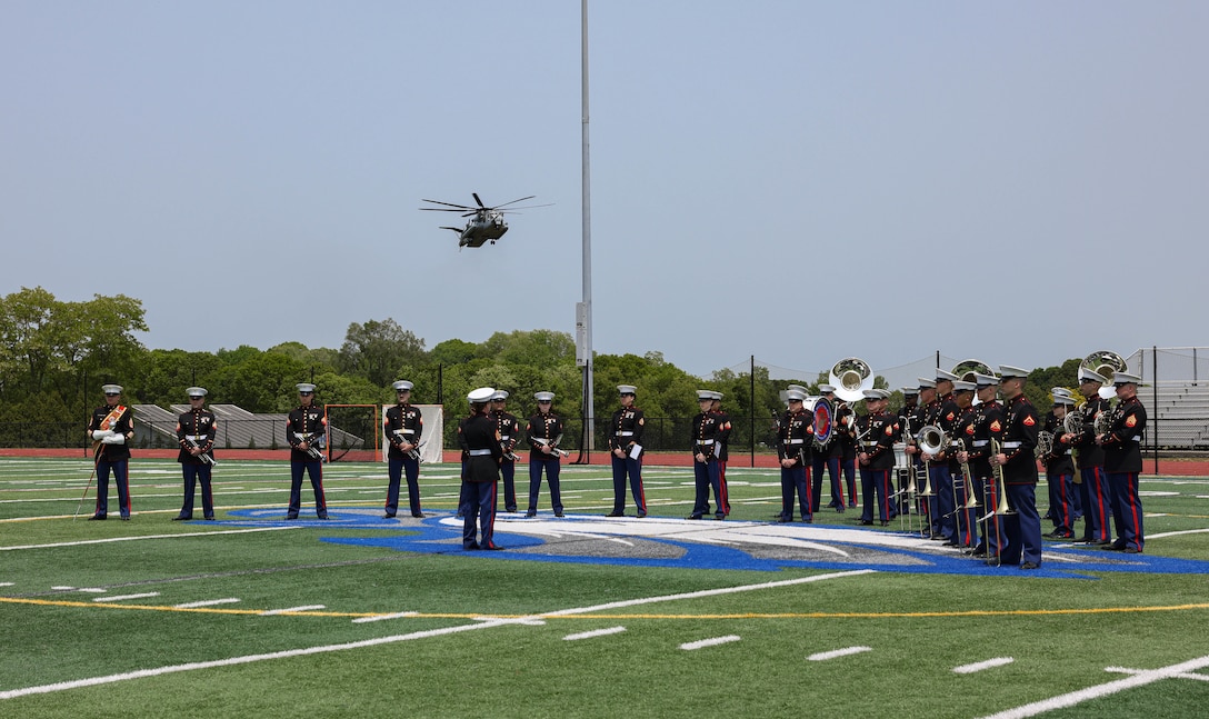 A CH-53E Super Stallion lands in a field behind the Hauppauge High School prior to The Quantico Marine Band’s performance on Long Island, New York, during the first day of Fleet Week New York (FWNY), May 24, 2023. More than 3,000 service members from the Marine Corps, Navy and Coast Guard and our NATO allies from Great Britain, Italy and Canada are engaging in special events throughout New York City and the surrounding Tri-State Region during FWNY 2023, showcasing the latest capabilities of today’s maritime services and connecting with citizens. The events include free public ship tours, military static displays, and live band performances and parades. (U.S. Marine Corps photo by Lance Cpl. David Brandes)