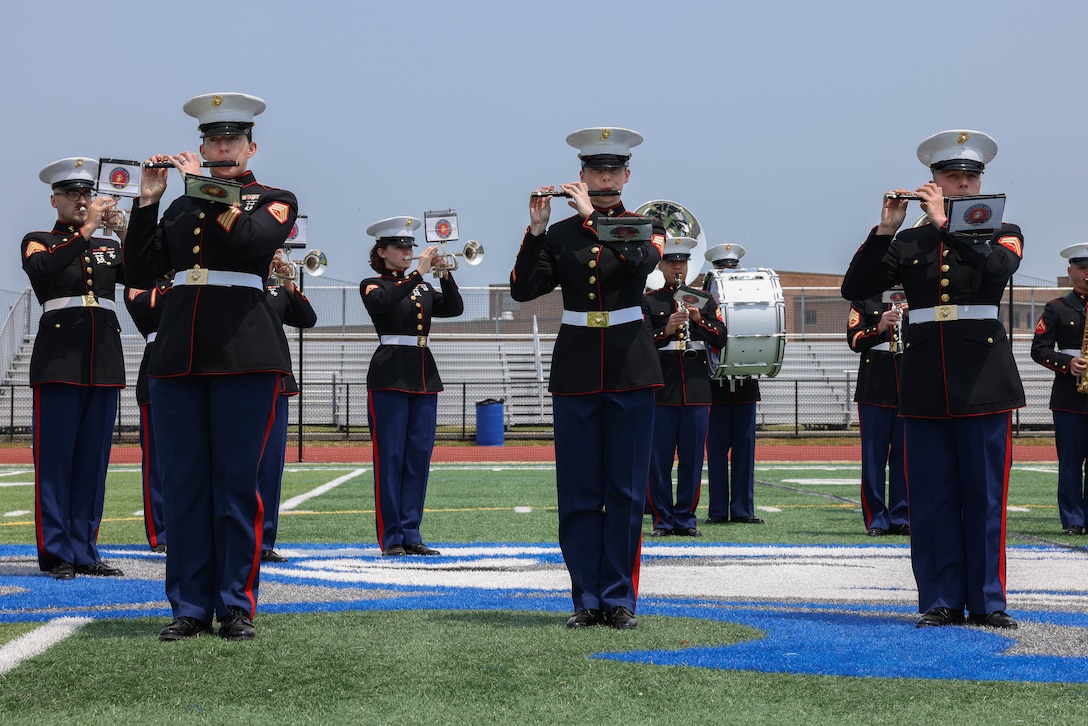 The Quantico Marine Band performs at Hauppauge High School, Long Island, New York during the first day of Fleet Week New York (FWNY), May 24, 2023. Throughout FWNY 2023, more than 3,000 service members from the Marine Corps, Navy and Coast Guard and our NATO allies from Great Britain, Italy and Canada are engaging in special events throughout New York City and the surrounding Tri-State Region, showcasing the latest capabilities of today’s maritime services and connecting with citizens. The events include free public ship tours, military static displays, and live band performances and parades. (U.S. Marine Corps photo by Lance Cpl. David Brandes)