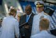 Secretary of Defense Lloyd J. Austin III awards a diploma at the U.S. Naval Academy's Class of 2023 graduation ceremony in Annapolis, Md., May 26, 2023.
