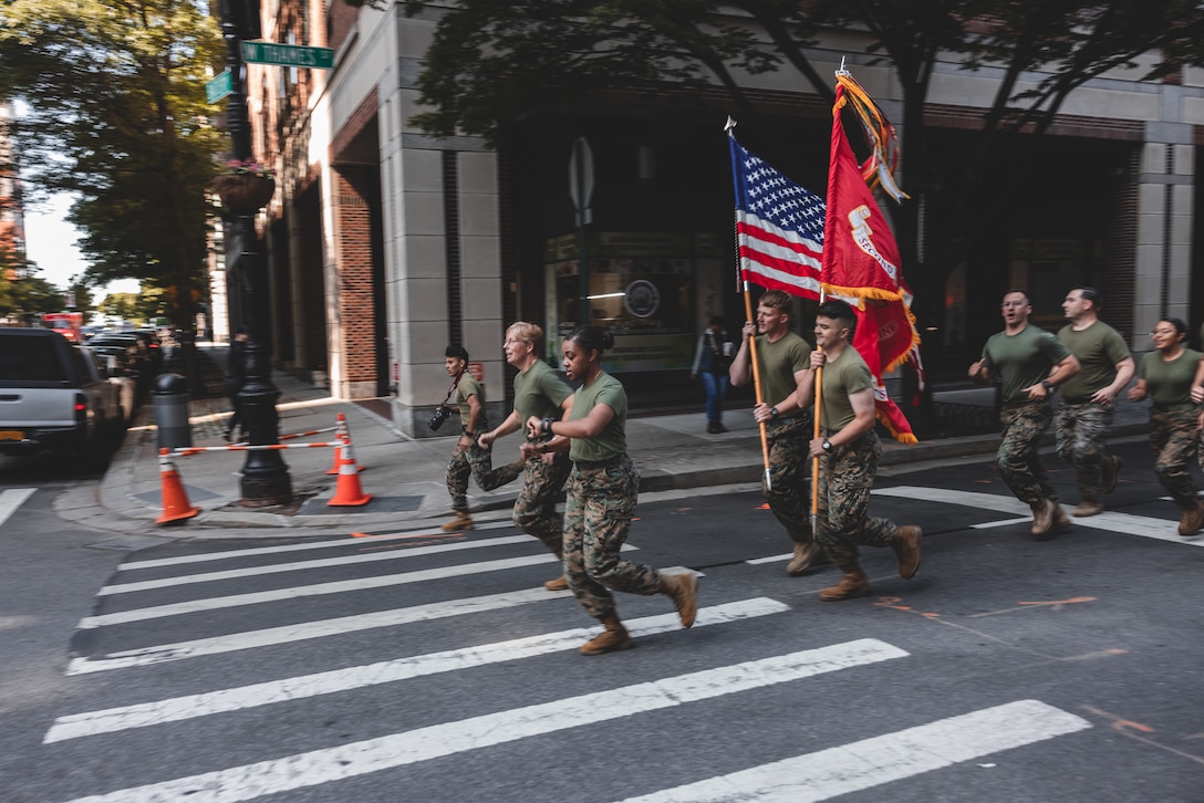 U.S. Marines and Sailors from Special Purpose Marine Air-Ground Task Force – New York run in formation to the 9/11 Memorial during Fleet Week New York (FWNY), May 25, 2023. FWNY 2023 provides an opportunity for the American public to meet Marines, Sailors, and Coast Guardsmen and see first-hand the latest capabilities of today’s maritime services. (U.S. Marine Corps photo by Cpl Meshaq Hylton)
