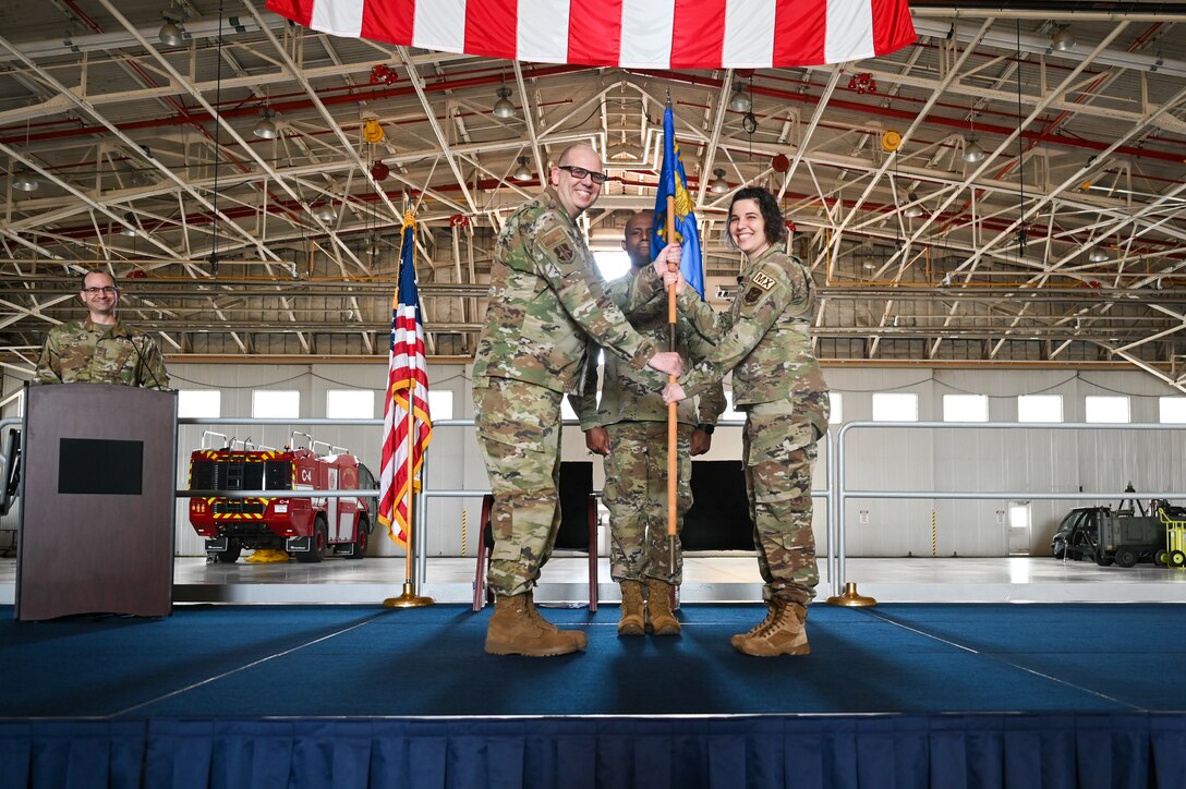 Maj. Jaime Smith receives the 914th Maintenance Squadron guidon flag, and thereby command of the 914 MXS, from Lt. Col. Keith McCray, 914th Maintenance Group commander.
