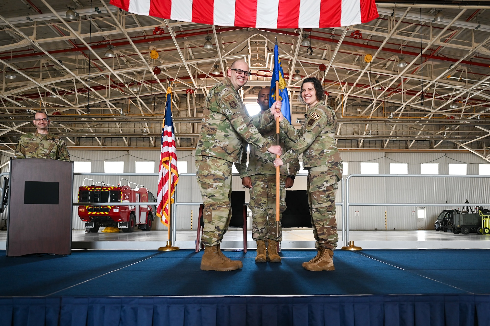 Maj. Jaime Smith receives the 914th Maintenance Squadron guidon flag, and thereby command of the 914 MXS, from Lt. Col. Keith McCray, 914th Maintenance Group commander.