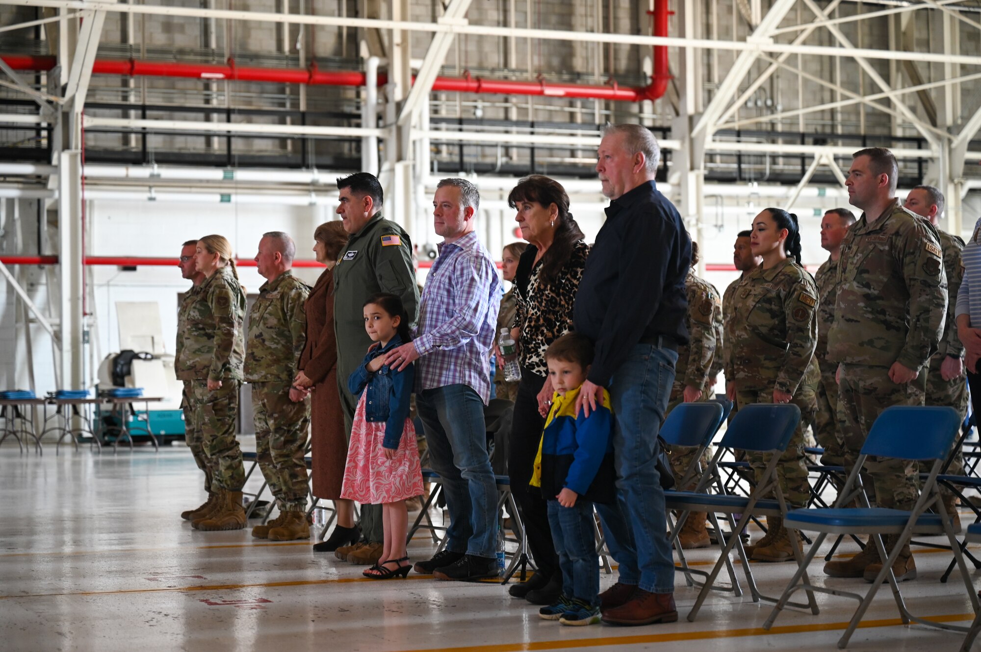Members of the 914th Air Refueling Wing and U.S. Air Force Maj. Jaime Smith’s family stand for the playing of the national anthem during the 914th Maintenance Squadron's Assumption of Command ceremony at Niagara Falls Air Reserve Station.