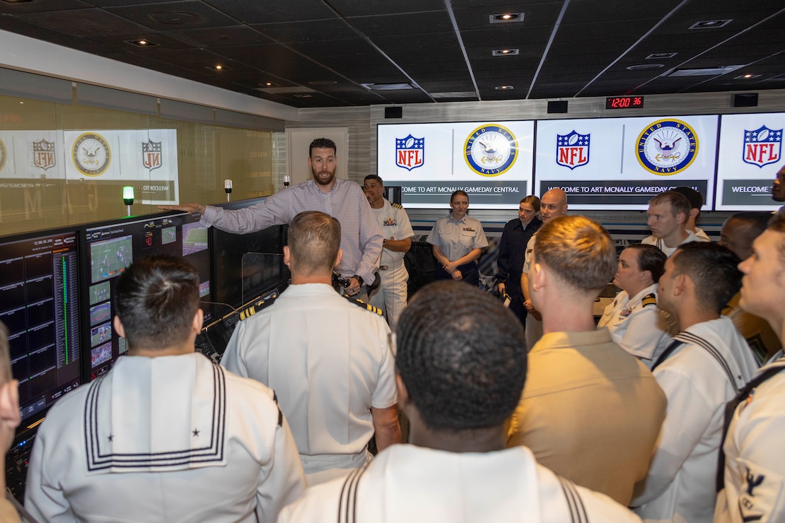 Mr. Frank Azczepanik, National Football League (NFL) Game Day replay supervisor, explains the NFL replay process to U.S. Marines, Sailors and Coast Guardsmen as part of a tour of the NFL Headquarters for Fleet Week New York (FWNY), May 25, 2023. During FWNY 2023, more than 3,000 service members from the Marine Corps, Navy and Coast Guard and our NATO allies from Great Britain, Italy and Canada are engaging in special events throughout New York City and the surrounding Tri-State Region, showcasing the latest capabilities of today’s maritime services and connecting with citizens. These events include free public ship tours, military static displays, and live band performances and parades. (Photo by Mass Communication Specialist 1st Class Pedro A. Rodriguez)