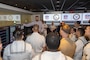 Mr. Frank Azczepanik, National Football League (NFL) Game Day replay supervisor, explains the NFL replay process to U.S. Marines, Sailors and Coast Guardsmen as part of a tour of the NFL Headquarters for Fleet Week New York (FWNY), May 25, 2023. During FWNY 2023, more than 3,000 service members from the Marine Corps, Navy and Coast Guard and our NATO allies from Great Britain, Italy and Canada are engaging in special events throughout New York City and the surrounding Tri-State Region, showcasing the latest capabilities of today’s maritime services and connecting with citizens. These events include free public ship tours, military static displays, and live band performances and parades. (Photo by Mass Communication Specialist 1st Class Pedro A. Rodriguez)