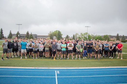  Members from Delta 3-Electromagnetic Warfare pose for a group photo before completing a Memorial Day workout on Peterson Space Force Base.