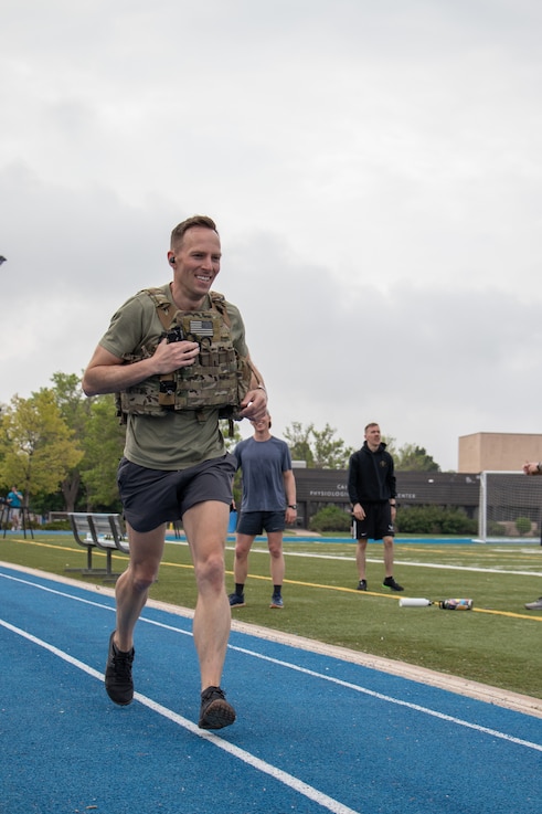 A servicemember completes a lap during Delta 3's Memorial Day Murph workout.
