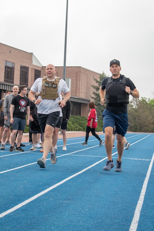  U.S. Space Force Col. Christopher Fernengel, left, sports a 20-lbs vest during Delta 3's Memorial Day workout.