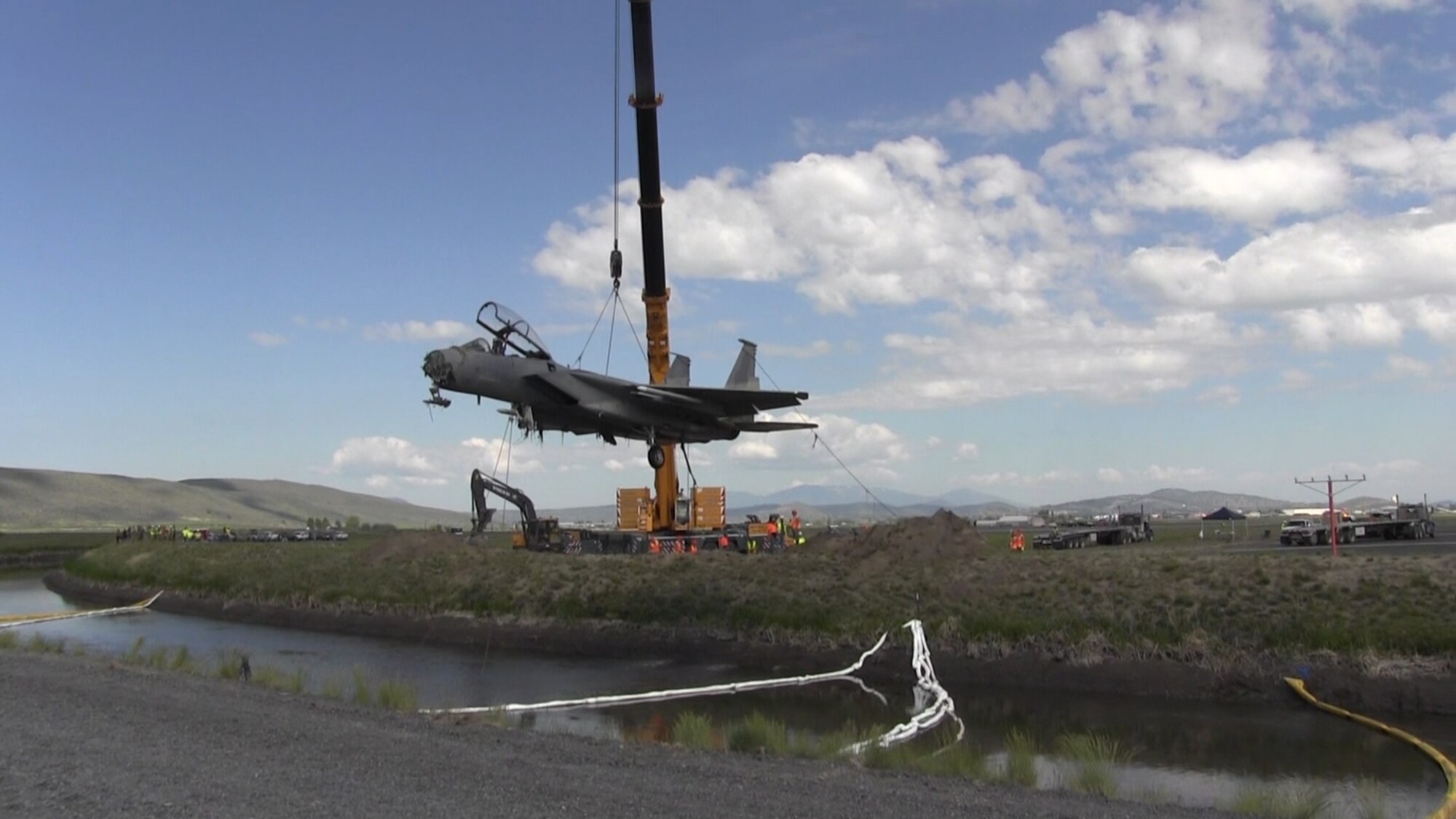 F-15 suspended by a crane