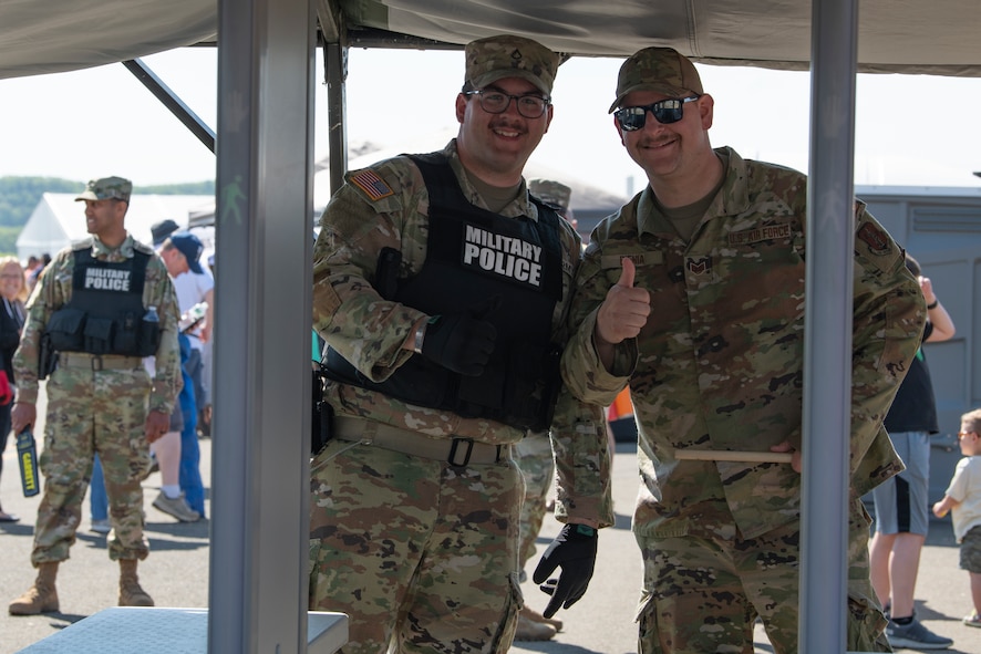 Members of the Massachusetts Air and Army National Guard pose for a photo prior to performing metal detection screenings at the 2023 Westfield International Air Show at Barnes Air National Guard Base, Massachusetts, May 14, 2023. The two-day event allowed the 104th Fighter Wing and joint-service partners to strengthen their community ties with over 70,000 members of the public by showcasing their capabilities, aircraft and equipment. (U.S. Air National Guard photo by Staff Sgt. Hanna Smith)