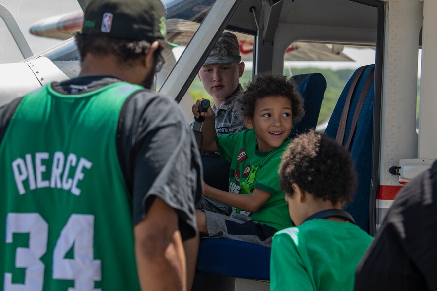 A child smiles while sitting in a Civil Air Patrol aircraft static display during the 2023 Westfield International Air Show at Barnes Air National Guard Base, Massachusetts, May 14, 2023. The two-day event allowed the 104th Fighter Wing and joint-service partners to strengthen their community ties with over 70,000 members of the public by showcasing their capabilities, aircraft and equipment. (U.S. Air National Guard photo by Staff Sgt. Hanna Smith)