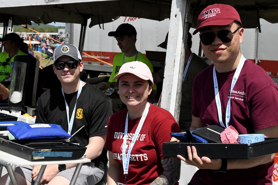 Rachael Fantoni, U.S. Air Force Reserve Officer Training Corps Cadet assigned to Detachment 370, University of Massachusetts-Amherst, volunteers with food vendors during the 2023 Westfield International Air Show, May 12, 2023, at Barnes Air National Guard Base, Massachusetts. Air shows are a public event held on base to provide an opportunity for people to see U.S. military air capabilities in action and meet the service members who fly and maintain the equipment. (Massachusetts Air National Guard Photo by Air Force SrA Camille Lienau)