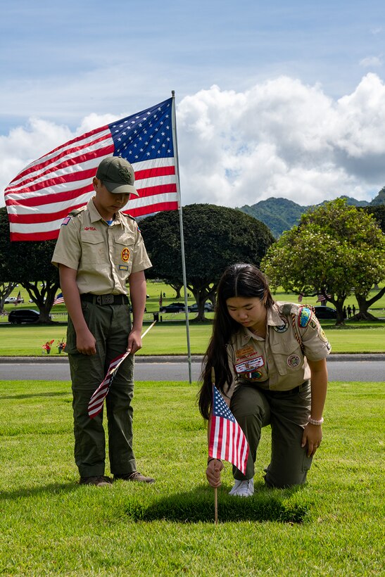 Alana Oishi-Agader and Alex Oishi-Agader, scouts from Troop 264 and Troop 664, Mililani, Hawaii, placed an American flag on the grave of an unknown service member at the National Memorial Cemetery of the Pacific -Punchbowl in Honolulu. Their act embodies the spirit of Memorial Day.

On this solemn federal holiday, we honor and mourn the brave U.S. military personnel who made the ultimate sacrifice while serving in the Armed Forces. We remember all unaccounted-for service members and DoD civilians/contractors, ensuring they will never be forgotten.

This Memorial Day, reflect on our fallen heroes' courage, dedication, and selflessness. Together, we ensure their legacies live on.

(U.S. Air Force Photo by Senior Airman Cole Yardley)