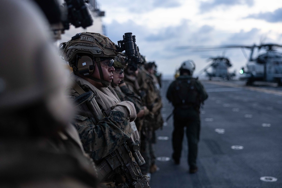 U.S. Marines with the 26th Marine Expeditionary Unit prepare to conduct a Tactical Recovery of Aircraft and Personnel (TRAP) as part of Composite Training Unit Exercise (C2X) aboard the Wasp-class amphibious assault ship USS Bataan (LHD 5), Atlantic Ocean, May 21, 2023. TRAP is a contingency mission utilized to rapidly respond to downed aircraft, and to recover personnel from isolated locations during deployment. C2X is the last exercise in the Pre-deployment Training Program for the Bataan Amphibious Ready Group. (U.S. Marine Corps photo by Cpl. Kyle Jia)