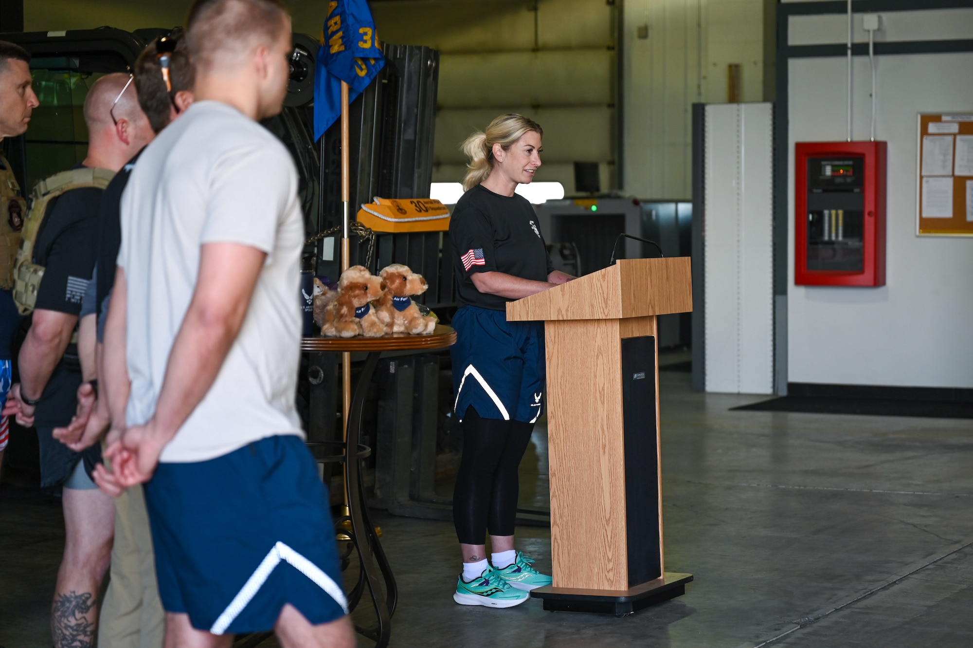 U.S. Air Force Lt. Col. Kristen Horan, 30th Aerial Port Squadron commander, illustrates the meaning and history behind the Port Dawgs Memorial Run to the runners on Niagara Falls Air Reserve Station, New York, on May 5, 2023.