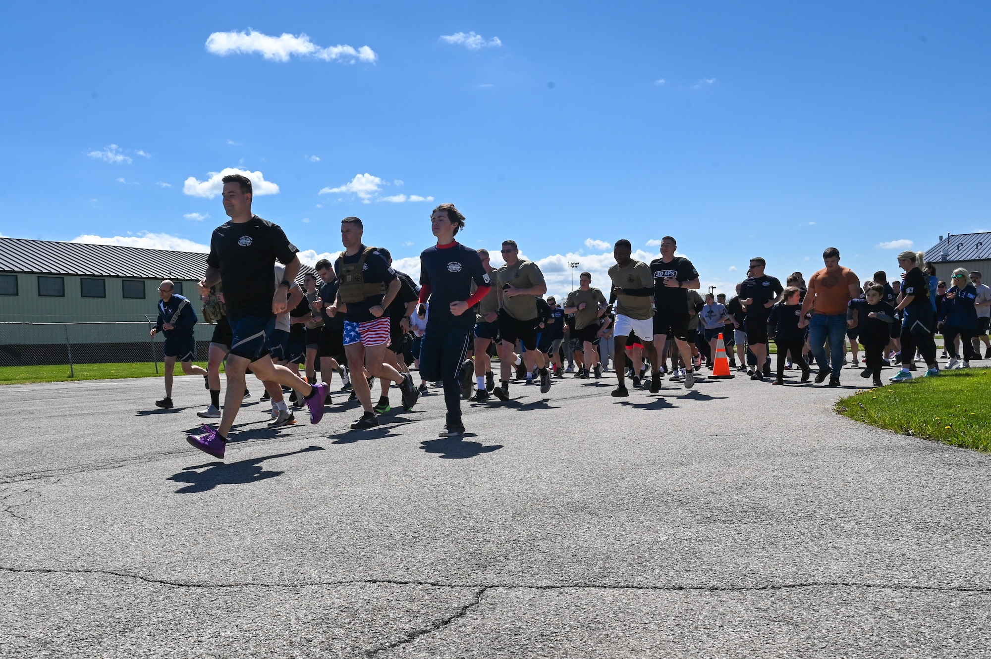 Runners take off at the start of the Port Dawgs Memorial Run at Niagara Falls Air Reserve Station, New York, on May 5, 2023.